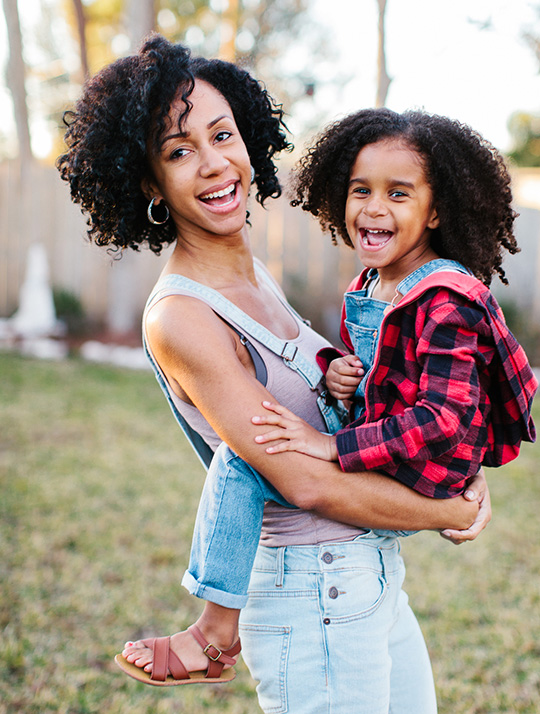 mother and daughter smiling